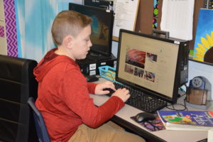 Boy Researching on the Computer