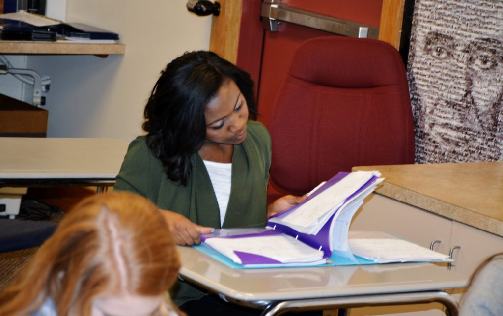Female Student Looking Through Folders