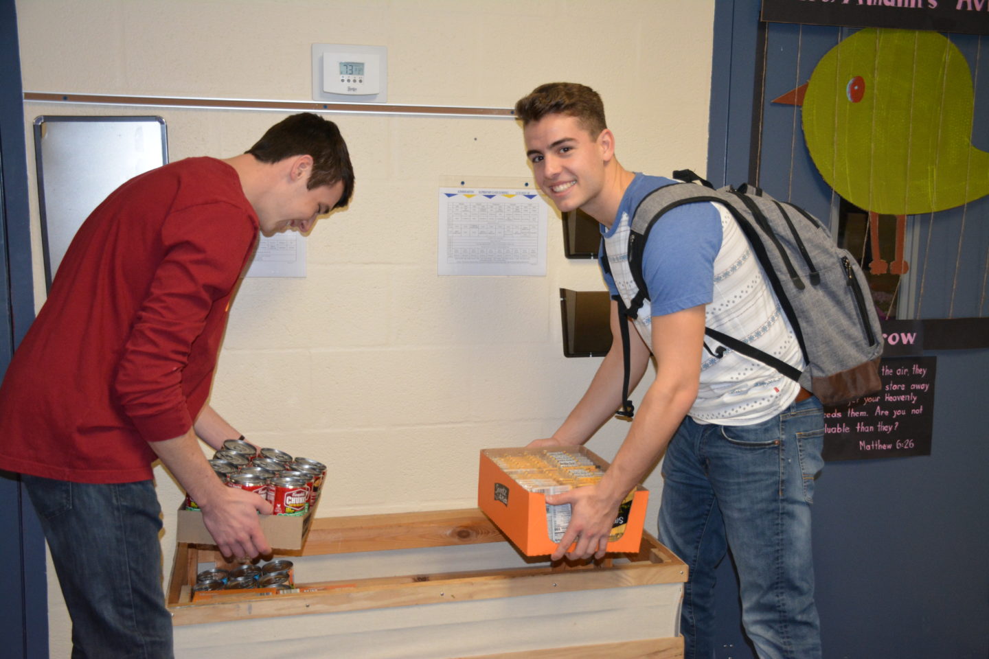 Two Students Donating Food