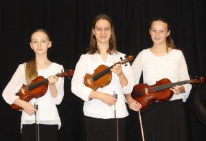 Three Junior High School Orchestra Students